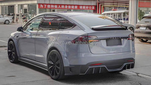 ชุดแต่งตัวถังรถยนต์ Tesla Model X ปี 2016-2018 คุณภาพสูง ผลิตจากคาร์บอนไฟเบอร์ ประกอบด้วยลิ้นหน้า สเกิร์ตข้าง ดิฟฟิวเซอร์หลัง และบังโคลน แบบยึดติดด้วยสกรู - Product Image 5