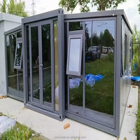 Maison de conteneur extensible de luxe de 40 pieds 20 pieds Pavillon de la série pliante à double aile avec disposition attenante, portes à calandre et fenêtres