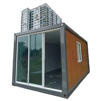 Maison conteneur préfabriquée en bois, démontable, avec grande fenêtre coulissante en verre, idéale pour gîte, bureau ou villa