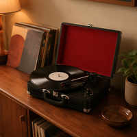 Tourne-disque vintage en forme de valise avec haut-parleurs intégrés pour salon