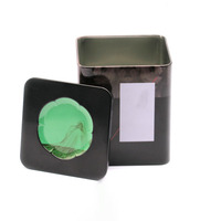 Lata de hierro de hojalata cuadrada negra con ventana circular verde para almacenar café y pequeño, lo que permite una fácil vista del contenido