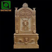 Statue de tête de lion en marbre, fontaine murale en pierre