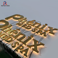 Enseigne rétroéclairée LED blanc chaud en acier inoxydable brossé or 304/316 personnalisée pour la décoration publicitaire de boutiques de luxe