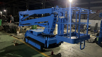 Ascenseur à chenilles hydraulique avec bras de flèche pliable pour le travail sur le toit, l'entrepôt, l'industrie et les installations extérieures