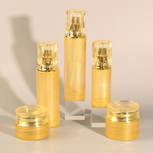 Ensemble d'emballages cosmétiques de luxe <span class=keywords><strong>en</strong></span> <span class=keywords><strong>verre</strong></span> rond doré, flacon pompe pour lotion et pot à crème pour sérum de soin de la peau - Product Image 1