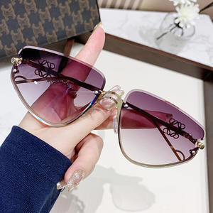 Gafas de sol ojo de gato sin marco de alta gama de diseñador de vacaciones de moda para mujer - Product Image 1