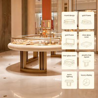Vitrine de présentation de bijoux ronde de luxe, cadre en métal doré, dessus en verre, comptoir d'îlot pour bijoux avec plateaux de présentation, boutique personnalisée