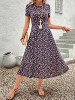 Robe florale de style européen et américain pour femmes, à manches courtes, robe imprimée élégante de longueur moyenne pour femmes. ODM OEM