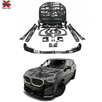 Kit carrosserie en fibre de carbone sèche style LD pour BMW XM G09 : Lame avant, diffuseur arrière, jupes latérales, capot, aileron arrière, extensions d'ailes