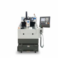 Machine CNC de haute précision pour le fraisage et la gravure de moules de gaufrage métallique, appliquée à l'industrie de l'impression