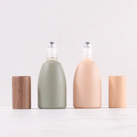 Nouvelles bouteilles à bille en verre transparent de 12 ml avec bouchon en bois et rouleau métallique, couleurs rose mat, vert et transparent, pour huiles essentielles et parfums.