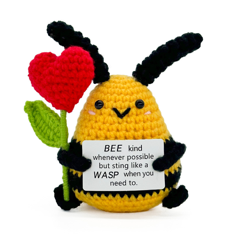 Big bee holding red heart