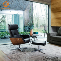 Fauteuil de bureau inclinable de luxe au design italien moderne avec appui-tête et repose-pieds, pivotant à 360°, idéal pour la salle de sport