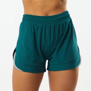 Pantalones cortos deportivos con forro de compresión para mujer, pantaloncitos cortos de nailon tejido elástico de 4 vías para entrenamiento y gimnasio, venta al por mayor - Product Image 5