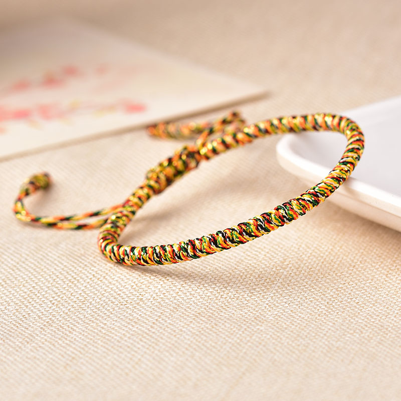 Bracciale portafortuna tibetano rosso intrecciato a mano con simbolo occhio regolabile