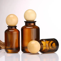 Vente en gros Flacons de parfum en verre ambré de luxe ronds de 30ml 50ml 100ml Flacon diffuseur en verre avec boule à bouchon rond