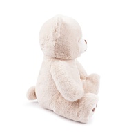 Ours en peluche crème en gros avec patins de pattes en forme de cœur rouge pour les boutiques de cadeaux et les détaillants de jouets