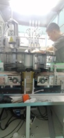 Mesin Perakitan Otomatis dengan Sistem Getar, Motor & Kontrol PLC untuk Pengumpanan dan Penutupan Tutup Botol dari Baja Tahan Karat