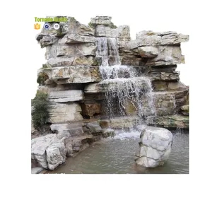 Artificial rock slide grotto and waterfall view from the raised spa