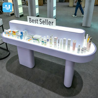 Meubles de magasin de beauté sur mesure, présentoir de pharmacie sur mesure, éclairage LED de luxe, table de présentation de cosmétiques pour les soins de la peau