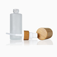 Kemasan kosmetik bambu kosong 30ml 50ml 60ml 100ml 120ml Losion kabut halus botol pompa kaca buram dengan tutup kayu bambu