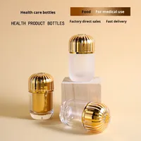 Bouteilles de capsules acryliques de qualité alimentaire haut de gamme bouteilles de distribution en plastique avec bouchon à vis joint produits de santé emballage de pilule vide