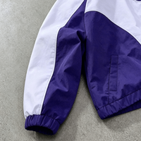 Ensemble survêtement homme Ouna personnalisé de haute qualité en polyester, veste coupe-vent courte et ample à capuche contrastante et pantalon de survêtement