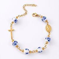 Bracelet chapelet en perles de porcelaine bleue et blanche avec croix en acier inoxydable, bijou religieux catholique vintage pour femmes