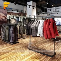 Magasins de vêtements modernes Magasins de mode pour magasins de détail Affichage de vestes et de t-shirts Présentoirs de vêtements personnalisés
