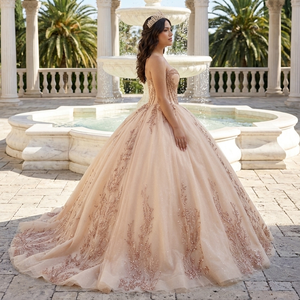 Elegante Vestido de Quinceañera Color Champán con Cristales y Hombros Descubiertos, con Lazo Grande - Product Image 1