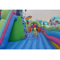 Château gonflable géant en PVC à prix d'usine, facile à installer pour les locations de fêtes en extérieur, avec toboggan pour enfants