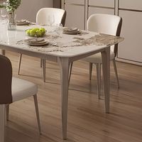 Ensemble table et chaises de salle à manger rectangulaire moderne européen en pierre frittée avec pieds en acier inoxydable, étanche et durable, pour appartement