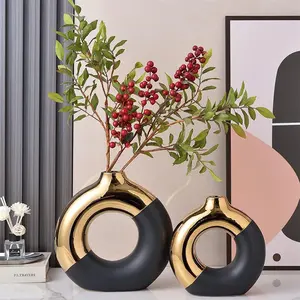 Niseven Beliebte einfache moderne Schwarz-Weißgold-Keramik vase Dekorative Ornamente Kreative Donut-förmige Keramik vase