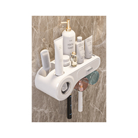 Support mural 2-en-1 en ABS+PS+Silicone pour cosmétiques et distributeur de dentifrice/brosse à dents, blanc/noir – Nouveauté 2024