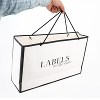 Premium Umweltfreundliche Recycelbare Wiederverwendbare Weiße Schwarze Rosa Luxus-Kleidungsboutique Geschenkpapiertüten mit Bandgriff