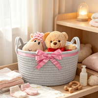 Panier de rangement rond en corde de coton gris tressé avec poignées en forme d'oreilles de chat pour organiser les petits objets sur le bureau
