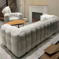 Canapé modulable sans structure en tissu bouclé, style Japandi, à segments arrondis, profil bas, personnalisable