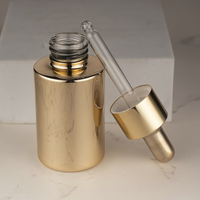Flacon compte-gouttes en or personnalisable de luxe 30 ml 1 oz pour soins de la peau, emballage en verre avec bouchon compte-gouttes doré avec revêtement UV