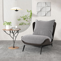 Fauteuil simple en tissu minimaliste de style nordique, design moderne et épuré, pour salon, forme irrégulière, pour la détente