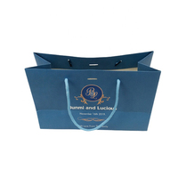 Sacs shopping en papier bleu personnalisés en gros avec poignée en corde et impression de logo pour emballage cadeau