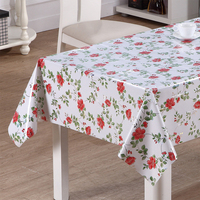 Nappe en vinyle imprimée au laser RNPT avec des feuilles tropicales en vert et rouille, support en PVC et tissu blanc pour tables à manger