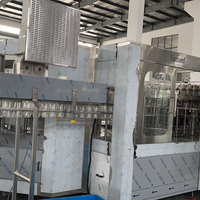 Projet clé en main automatique 12000bph 1L bouteille PET boisson gazeuse eau étincelante CSD Soda Cola Machine de remplissage