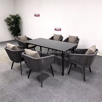 Ensemble de salle à manger d'extérieur en aluminium avec fauteuils en corde tressée à la main, table en pierre frittée, mobilier de patio