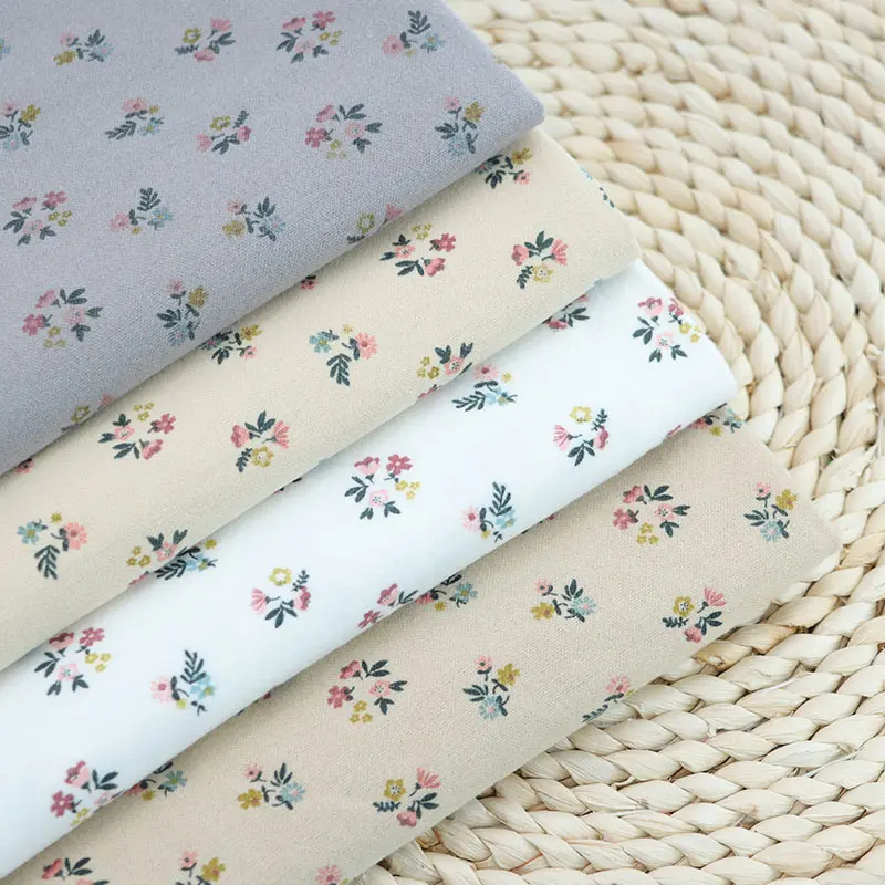 Salida de fábrica de alta calidad, tela de algodón con estampado de franela de fondo teñido liso, ropa para niños, camisa, pantalones, tela de vestir