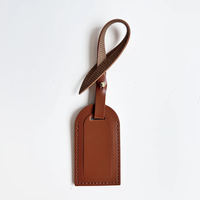 Étiquette de bagage en cuir PU lisse anti-perte pour sacs à dos et valises de voyage, accessoire de charme, vente chaude