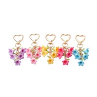 Nouveau porte-clés en alliage de zinc couleur Rush, en forme de cœur, avec fleur colorée style carillon éolien, créatif et frais, à double pétale, breloque de sac