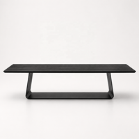 Table de salle à manger moderne VANTOR en bois de manguier noir pour 6 personnes avec base en métal architecturale de conception ovale pour les intérieurs de luxe