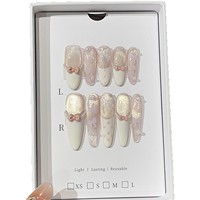 OEM ODM Vente en gros Faux ongles à presser réutilisables, style élégant, peints à la main, blanc laiteux, motif pois français, rose, or, effet œil de chat cristal, en ABS, CE
