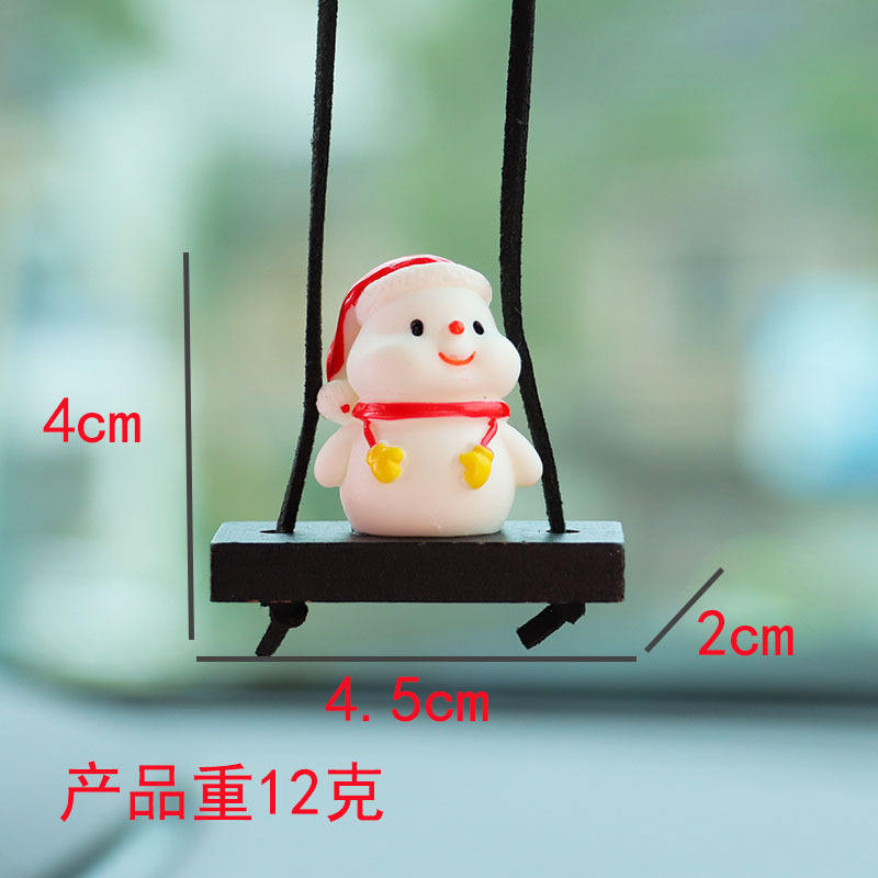 ถุงมือสีเหลืองแขวนอยู่บนตุ๊กตาหิมะ