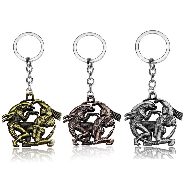 A Keychain Featuring Alien Vs. Predator, With a Key Ring and Key Clip, Designed in Anime, Movie, and Game Style